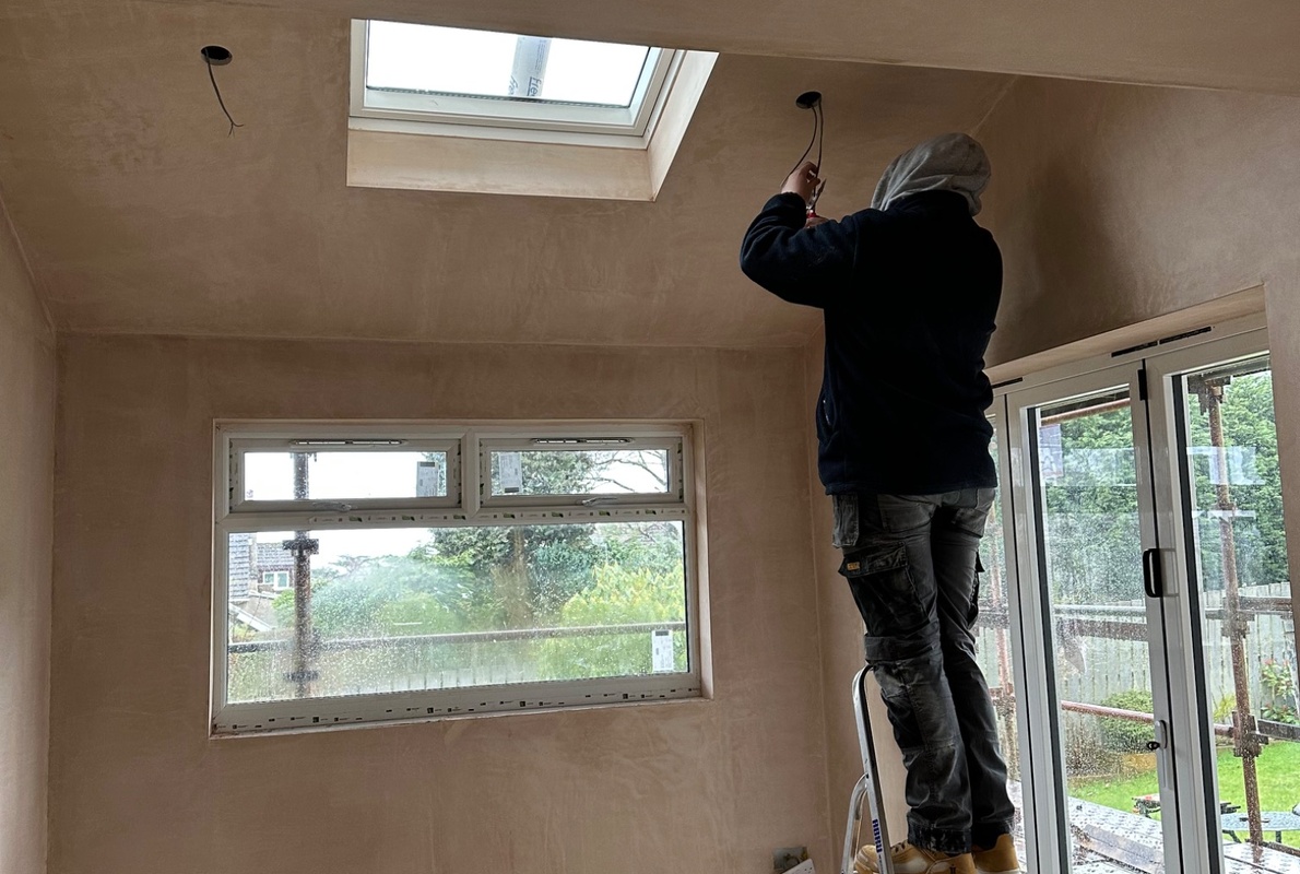 Adam from dreamy electrics fitting new light fixtures in Helensburgh